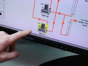 Wayne White, production supervisor, points to an indicator reading that fluoride is OS (out of service) in the control room at the A.H. Weeks Water Treatment Plant, Monday, March 25th, 2013.  (DAX MELMER/The Windsor Star)