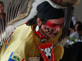 First Nations northern traditional dancer Gabe Bennett, in Lakota-Sioux and Odawa attire, performs at St. Clair College Centre for the Arts Friday March 15, 2013.  (NICK BRANCACCIO/The Windsor Star)