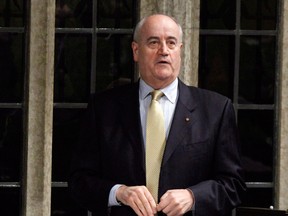 Julian Fantino, Associate Minister of National Defence, stands during Question Period in the House of Commons, in Ottawa, Tuesday March 27, 2012. Prime Minister Stephen Harper is replacing outgoing Bev Oda with Julian Fantino as Canada's new international co-operation minister. THE CANADIAN PRESS/Fred Chartrand