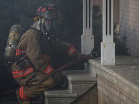 ESSEX, ONT.:MARCH 9, 2013 -- A Firefighter with the Essex Fire Department tends to a house fire at 14013 Walker Road, Saturday, March 9, 2013. No injuries were reported. (DAX MELMER/The Windsor Star)