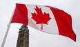 A Canadian flag flies on Parliament Hill Friday February 15, 2013 in Ottawa. (THE CANADIAN PRESS/Adrian Wyld)