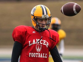 Lancers kicker Dan Cerino is focusses on the ball during spring training camp at Alumni Field March 26, 2013.  (NICK BRANCACCIO/The Windsor Star)
