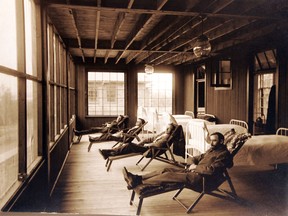 Before antibiotics, fresh air and rest were the main treatment for tuberculosis. These patients are on the veranda of the Ninette sanatorium in 1912.  (Archives of Manitoba)