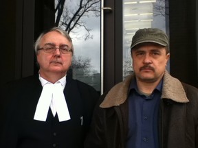 Defense lawyer Edward Burlew (left) and his client Alexandr Shishkin stand outside Ontario Superior Court Tuesday. Shishkin was fined and avoided jail time for smuggling Second Word War gun parts into Canada in 2010. (Monica Wolfson/The Windsor Star)