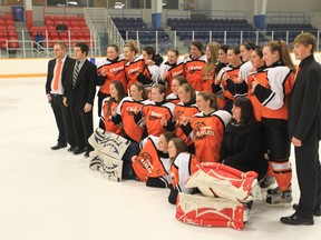 The L'Essor Aigles celebrate their A/AA WECSSAA girls hockey final victory over  Lajeunesse at Tecumseh Arena on March 1, 2013 in Tecumseh, Ontario.