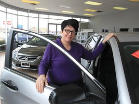 Windsor Honda salesperson Mary McCutcheon says the Internet provides women with vehicle information such as safety features and fuel economy, while also making it easy to make monthly payments. (JASON KRYK / The Windsor Star)