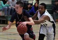 Anthony Pollock, left, of Holy Names dribbles past Avery Sutton of Kitchener St. Mary's during the OFSAA AAAA senior boys basketball championships at Herman high school Monday March 4, 2013.  (NICK BRANCACCIO/The Windsor Star)