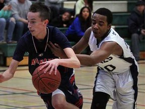 Anthony Pollock, left, of Holy Names dribbles past Avery Sutton of Kitchener St. Mary's during the OFSAA AAAA senior boys basketball championships at Herman high school Monday March 4, 2013.  (NICK BRANCACCIO/The Windsor Star)