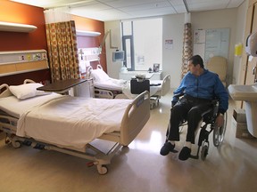 Tom Palameta checks out his new room at the renovated facility.  (DAN JANISSE/The Windsor Star)