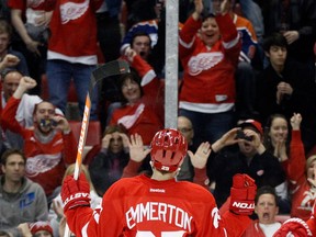 In this file photo, Detroit Red Wings center Cory Emmerton (25) and fans celebrates his goal during the second period of an NHL hockey game against the Edmonton Oilers, Thursday, March 7, 2013, in Detroit. The Red Wings defeated the Oilers 3-0. (AP Photo/Duane Burleson)
