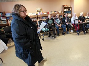 Cathy Nantais (L), coordinator of the Neighbourhood Watch program at 920 Ouellette Ave., speaks before tenants at the program's launch on Mar. 19, 2013. (Tyler Brownbridge / The Windsor Star)