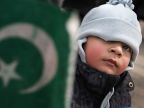 WINDSOR, ONT.:MARCH 24, 2013 -- Syed Mohammad Ali Raza, 3, holds a Pakistani flag as Windsor's Pakistani community celebrates Pakistan Day at city hall, Sunday, March 24, 2013.  (DAX MELMER/The Windsor Star)