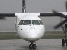 A Porter Airlines' plane lands Wednesday April 27, 2011, at the Windsor Airport in Windsor, Ont.  (Dan Janisse/The Windsor Star)