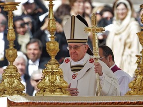 Pope Francis walks past the alter in front of St. Peter's Basilica in St. Peter's Square following his inauguration Mass at the Vatican, Tuesday, March 19, 2013. (AP Photo/Gregorio Borgia)