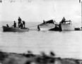 In this file photo, a Windsor Star photographer had been warned that "it would be just too bad for him" if he attempted to take this picture - but here it is. It shows rum runners salvaging a rum boat and 300 cases of liquor from a sand bar about a mile east of Leamington in this undated file photo. The boat had put out from Kingsville for an "undetermined destination," but was forced to put back and then collapsed on the sand bar. The photograph was taken from behind sheltering bushes on the shoreline.  (FILES/The Windsor Star)