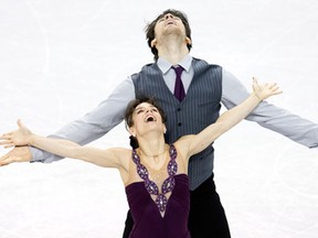 Meagan Duhamel and Eric Radford of Canada celebrate after their performance in the pairs free program as the ISU World Figure Skating Championships in London, Ontario on Friday March 15, 2013. THE CANADIAN PRESS/Frank Gunn