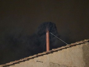Black smoke billows out from a chimney on the roof of the Sistine Chapel indicating that the College of Cardinals have failed to elect a new Pope on March 12, 2013 in Vatican City, Vatican. Pope Benedict XVI's successor is being chosen by the College of Cardinals in Conclave in the Sistine Chapel. The 115 cardinal-electors, meeting in strict secrecy, will need to reach a two-thirds-plus-one vote majority to elect the 266th Pontiff.  (Photo by Peter Macdiarmid/Getty Images)