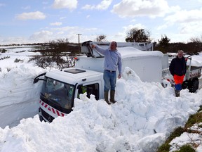 The vehicle of a GRDF (French Network of distribution of natural gas) technician is blocked after heavy snowfall on March 13, 2013 in Digulleville, northern France. More than 68,000 homes were without electricity in France and hundreds of people were trapped in their cars after a winter storm hit with heavy snow, officials and weather services said on March 12. Twenty-six regions in northwest and northern France were put on orange alert because of heavy snowfalls, which Meteo France said were "remarkable for the season because of the expected quantity and length of time".    AFP PHOTO / ALAIN JOCARD Getty Images