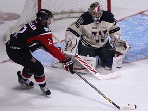 Niagara's Jesse Graham, left, shoots on Windsor goalie, Jordan DeKort earlier this season at the WFCU Centre. The Spitfires lost 9-4 to the IceDogs Sunday in St. Catharines.
(Windsor Star files)