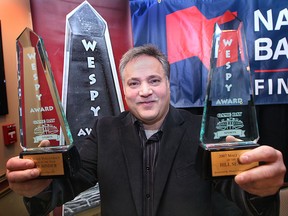 Dominic Papa, founder of the Windsor Essex County Sports Persons of the Year Awards shows samples of the hardware Jan. 13, 2010, during a news conference at  the Capitol Theatre in Windso.Two new awards were announced honoring the late Gino Fracas and Wayne Curtin. (DAN JANISSE/The Windsor Star)