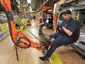 A worker Chrysler Windsor Assembly Plant, Thursday, Mar. 7, 2013, in Windsor, Ont.  (DAN JANISSE/The Windsor Star)