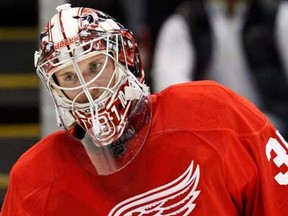 Red Wings goalie Jimmy Howard skates around the ice after giving up three goals in the first period against the Chicago Blackhawks, Sunday, March 31, 2013, in Detroit.  (AP Photo/Duane Burleson)