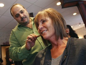 Youssef Greige puts the finishing touches on Theresa Conelli's hair at Youssef Hair Boutique in Windsor on Saturday December 15, 2007.  (Windsor Star - Tyler Brownbridge)