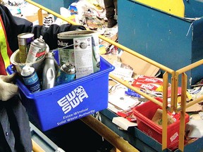 Files:Aerosol bottles and empty paint cans go into blue boxes in the city and county for pickup or drop off at the Essex-Windsor Solid Waste Authority. (Windsor Star files)