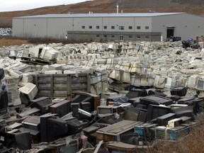 Someone has to pay to have electronics recycled. (Postmedia News files)