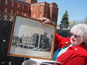 Ethel Dodman, vice-president of the nurses alumni, shows the crowd an old photo of Grace Hospital while at a final farewell ceremony for the former hospital, Saturday, April 27, 2013.  About 150 people attended the event.  (DAX MELMER/The Windsor Star)