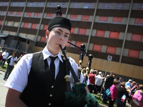 Cameron Beggs plays the bagpipes at a farewell ceremony for the former Grace Hospital on Crawford Avenue next to the former hospital, Saturday, April 27, 2013.  About 150 people attended the event.  (DAX MELMER/The Windsor Star)