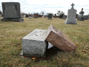 An overturned headstone in the St. Alphonsus Cemetery in Windsor is seen in this photo from 2009. Close to 60 grave markers were vandalized on that occasion. Letter writer Theresa Hardy wants vandals to know that stealing from graves causes families pain and anguish.  (Windsor Star files)