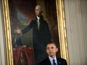 U.S. President Barack Obama, seen here in the East Room of the White House April 5, 2013, says his budget plan to be released Wednesday will provide long-term deficit reduction without harming the economy. (BRENDAN SMIALOWSKI/AFP/Getty Images)