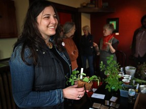 Pina Ciotoli, co-owner of WindsorEats , discusses seeds and gardening at WindsorEats Community Seed/ling Swap at Rino's Kitchen, Saturday, April 13, 2013.  The event tries to encourage people to start using gardens as well as exchange seeds for the upcoming growing season.  (DAX MELMER/The Windsor Star)