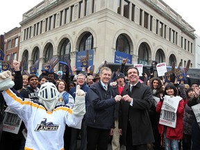 University of Windsor president Alan Wildeman, centre front, accepts keys to The Windsor Star's Ferry Street building from Windsor Star publisher and editor in chief Marty Beneteau in November 2012. Letter writer Sheryl Davies of Windsor, is excited to have a stronger university presence downtown, and says The Lance plays a key role in the revitalization of the city.
(Windsor Star files)