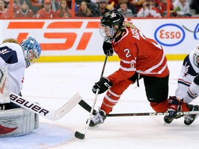 Ruthven's Meghan Agosta-Marciano, right, takes a shot on Team USA's Jessie Vetter in the women's world championship game at Scotiabank Place in Ottawa. (Photo by Richard Wolowicz/Freestyle Photography/Getty Images)
