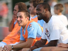 Windsor Stars' Stephen Ademolu, right, watches the game with Ryan Wise against the York Region Shooters at Windsor Stadium. (KRISTIE PEARCE/The Windsor Star)