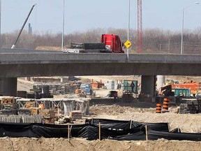 Newly completed portion of Highway 3 running east from Howard Avenue to Huron Church Line on the Herb Gray Parkway, opened Wednesday April 3, 2013. In photo, traffic flows over Highway 3 bridge as work continues on six lanes of Highway 401, below. (NICK BRANCACCIO/The Windsor Star)