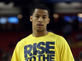 Trey Burke of the Michigan Wolverines warms up against the Louisville Cardinals during the 2013 NCAA Men's Final Four Championship at the Georgia Dome in Atlanta. (Photo by Streeter Lecka/Getty Images)