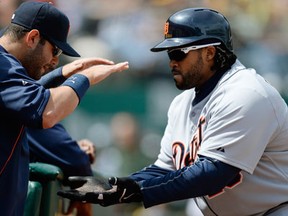 Detroit's Prince Fielder, right, is congratulated by Alex Avila after Fielder hit a solo home run against the Oakland Athletics in the fourth inning in Oakland. (Photo by Thearon W. Henderson/Getty Images)