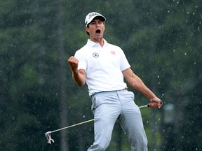 Adam Scott of Australia celebrates after making a birdie on the 18th hole during the final round of the 2013 Masters Tournament at Augusta National Golf Club on April 14, 2013 in Augusta, Georgia.  (Photo by Harry How/Getty Images)