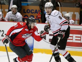 Windsor's Ryan Verbeek, left, checks Owen Sound's Cody Ceci at the WFCU Centre. (NICK BRANCACCIO/The Windsor Star)