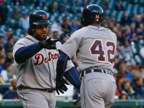 Detroit's Austin Jackson, right, is congratulated by Prince Fielder after scoring on an RBI single by Miguel Cabrera in the first inning against the Seattle Mariners at Safeco Field Tuesday.  (Photo by Otto Greule Jr/Getty Images)