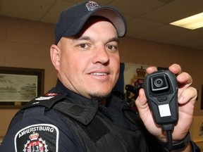 Amherstburg Police Sgt. Scott Riddell displays a body-worn video camera which will be used by police while attending calls, Friday April 19, 2013. (NICK BRANCACCIO/The Windsor Star)
