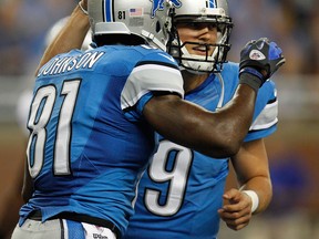 Detroit's Calvin Johnson, left, celebrates a touchdown with Matthew Stafford at Ford Field. (Photo by Gregory Shamus/Getty Images)