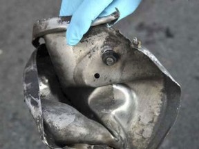 This photograph obtained April 16, 2013 courtesy of the Federal Bureau of Investigation (FBI) shows the remnants of a pressure cooker the FBI says was part of one of the bombs used during the Boston Marathon on April 15, 2013.  US investigators have told how two suspected pressure cooker bombs sprayed nails and metal pellets into Boston marathon crowds, killing three people and injuring more than 180. AFP PHOTO / FBI