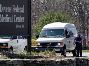 A guard stands near the entrance to the Devens Federal Medical Center (FMC) in Devens, Mass., Friday, April 26, 2013. The U.S. Marshals Service said Friday that Dzhokhar Tsarnaev, charged in the April 15, 2013 Boston Marathon bombing, had been moved from a Boston hospital to the federal medical center at Devens, about 40 miles west of the city. (AP Photo/Elise Amendola)