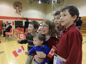 Erin Murray and her children Ryan Harvey, 10, Liam Harvey, Garrett Harvey, Colin Harvey after they were sworn in as Canadian citizens at Forster Secondary School in Windsor, Ontario on April 24, 2013.  The young family immigrated from the United States and are very happy to become Canadian citizens. (JASON KRYK/The Windsor Star)