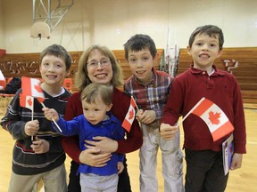 In this file photo, Erin Murray and her children Ryan Harvey, 10, Liam Harvey, Garrett Harvey, Colin Harvey after they were sworn in as Canadian citizens at Forster high school in Windsor, Ontario on April 24, 2013.  The young family immigrated from the United States and are very happy to become Canadian citizens. (JASON KRYK/The Windsor Star)