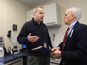Albert Guite, from Statistics Canada, left, talks with Windsor Essex County Health Unit Medical Officer of Health Dr. Allen Heimann in the Canadian Health Measures Survey mobile clinic in Windsor, Ontario on April 3, 2013. The Canadian Health Measures Survey is an ongoing national health survey travelling across the country and collecting information using direct physical measurements such as blood pressure, height, weight and waist circumference. Blood and urine samples are also collected to test for chronic and infectious disease markers, as well as markers of nutritional status and exposure to environmental substances. (JASON KRYK/The Windsor Star)